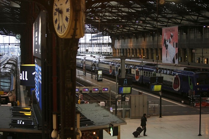 A man walks in the deserted Gare de Lyon train station, Friday, Dec. 6, 2019 in Paris. (AP Photo/Rafael Yaghobzadeh)
