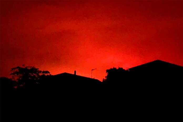 This Tuesday, Dec. 31, 2019, photo provided by Twitter user @AvaTheHuman shows red sky from wildfires burning, in Victoria, Australia. (@AvaTheHuman via AP)
