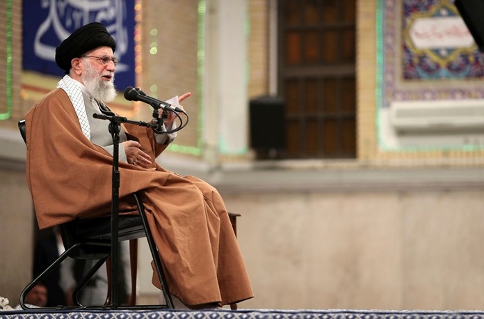 In this photo released  by the official website of the office of the Iranian supreme leader, Supreme Leader Ayatollah Ali Khamenei speaks during a meeting, in Tehran, Iran, Wednesday, Jan. 1, 2020. Khamenei criticized the U.S. airstrikes on the Iran-backed Iraqi militia on Sunday. He accused the U.S. of taking revenge on Iran for the defeat of the Islamic State group, which he said was an American creation. He condemned U.S. "wickedness," according to the remarks carried by the semi-official ISNA news agency. (Office of the Iranian Supreme Leader via AP)