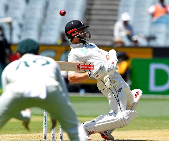 New Zealand's Kane Williamson avoids a bouncer from Australia's Pat Cummins during their cricket test match in Melbourne, Australia, Sunday, Dec. 29, 2019. With the three-test series between Australia and New Zealand decided, players from both teams will momentarily turn their attention away from the pitch at the Sydney Cricket Ground and to the deadly wildfires around the country. (AP Photo/Andy Brownbill)