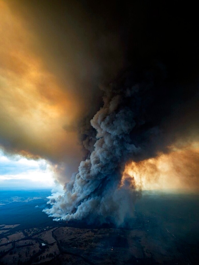 In this image released Thursday, Jan. 2, 2020, from the DELWP Gippland, shows massive smoke rising from wildfires burning in East Gippsland, Victoria. (DELWP Gippland via AP)