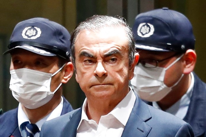 In this April  25, 2019, file photo, former Nissan Chairman Carlos Ghosn leaves Tokyo's Detention Center for bail in Tokyo. By jumping bail, Ghosn, who had long insisted on his innocence, has now committed a clear crime and can never return to Japan without going to jail. (Kyodo News via AP, File)