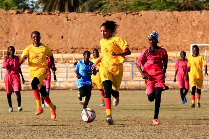 In this Wednesday, Dec. 11, 2019 photo, Sudanese al-Difaa, in yellow, and al-Sumood women teams play in Omdurman, Khartoum's twin city, Sudan. (AP Photo)