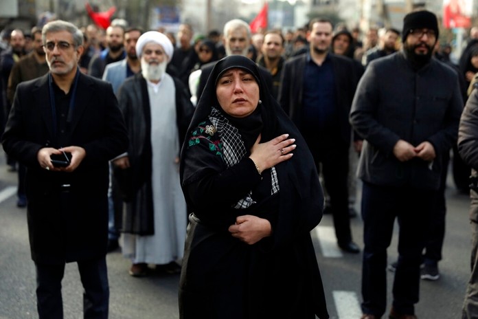 A woman mourns in a demonstration over the U.S. airstrike in Iraq that killed Iranian Revolutionary Guard Gen. Qassem Soleimani in Tehran, Iran, Jan. 3, 2020. (AP Photo/Vahid Salemi)