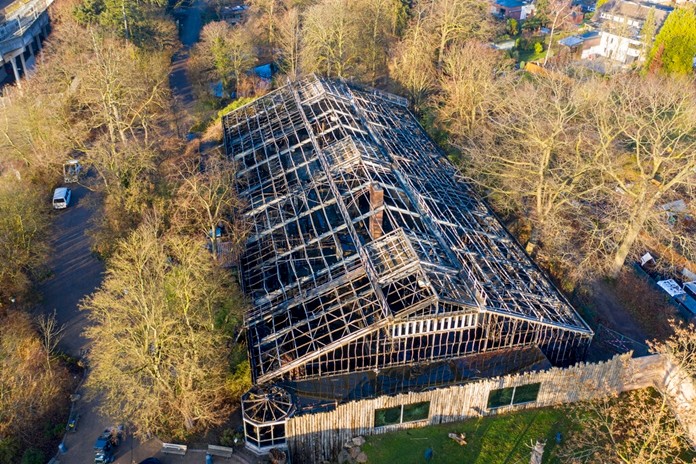 This Jan. 1, 2020 photo, shows a burned down animal house at the Zoo in Krefeld, Germany. (Christoph Reichwein/dpa via AP)