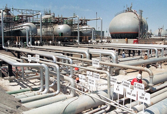 In this file photo dated 1990, Aramco refinery at Ras Tannura, Saudi Arabia. The price of oil surged Friday Jan. 3, 2020, as global investors were gripped with uncertainty over the potential repercussions and any retaliation, after the United States killed Iran's top general Qassem Soleimani. (AP Photo/FILE)