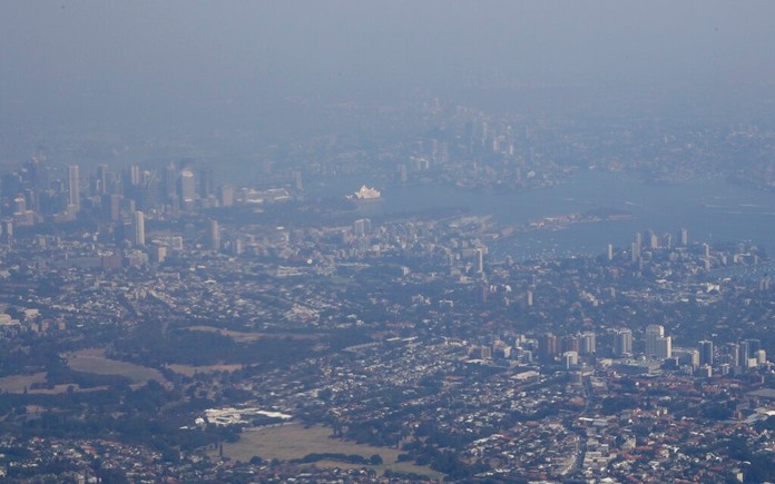 Bushfire smoke shrouds the skyline of Australia's largest city Sydney, Saturday, Jan. 4, 2020. (AP Photo/Mark Baker)