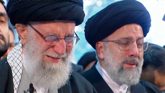 In this image taken from video, Iranian Supreme Leader Ayatollah Ali Khamenei, left, openly weeps as he leads a prayer over the coffin of Gen. Qassem Soleimani, who was killed in Iraq in a U.S. drone strike on Friday, at the Tehran University campus, in Tehran, Iran, Monday, Jan. 6, 2020. (Iran Press TV via AP)