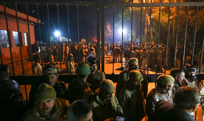 In this late Sunday, Jan.5, 2020 photo, police arrive at the Jawaharlal Nehru University after masked assailants beat students and teachers with sticks in New Delhi, India. (AP Photo)