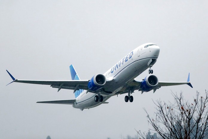 In this Dec. 11, 2019, file photo, an United Airlines Boeing 737 Max airplane takes off in the rain at Renton Municipal Airport in Renton, Wash. (AP Photo/Ted S. Warren, File)