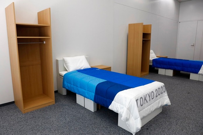 Two sets of bedroom furniture, including cardboard beds, for the Tokyo 2020 Olympic and Paralympic Villages are shown in a display room Thursday, Jan. 9, 2020, in Tokyo. (AP Photo/Jae C. Hong)