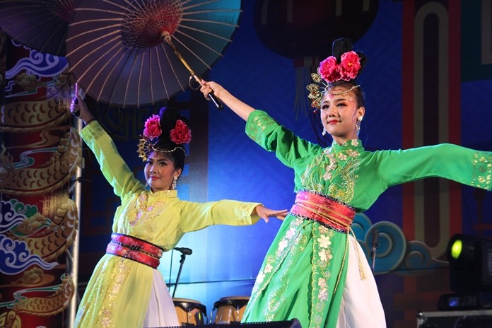 Dancers perform a fan dance during the Chinese Arts and Culture show at Lan Pho Public Park in Naklua.