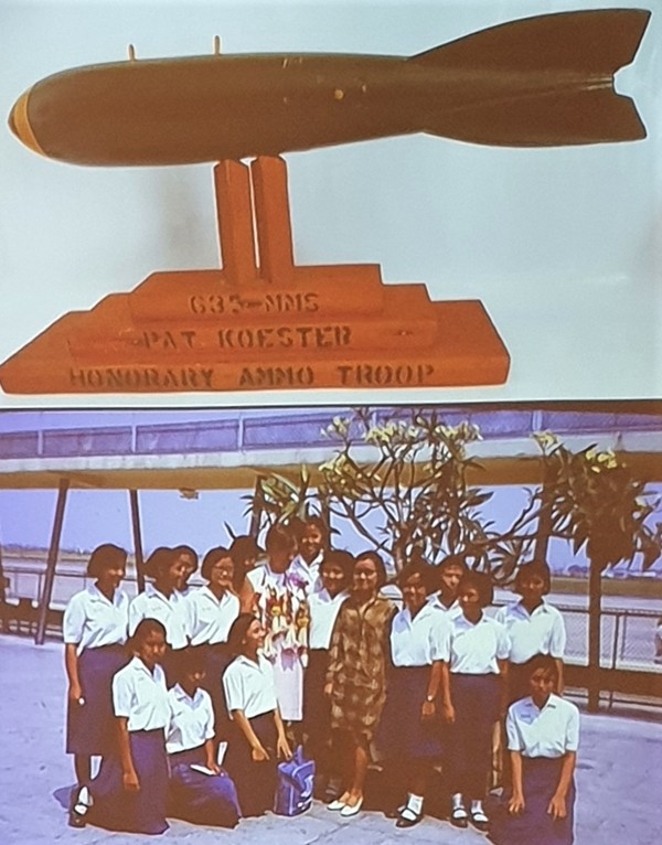 This slide represents some of her mementos Pat Koester said. The top is a bomb replica presented to her by airmen from U-Tapao Airfield that loaded the ordinance on the B-52s and the bottom is some of the children from where she lived during her time as a Peace Corps Volunteer.