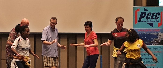 It's all in how you move your hips! Four PCEC audience members join Juliett and Lydia on stage to try out their Ugandan dance moves.