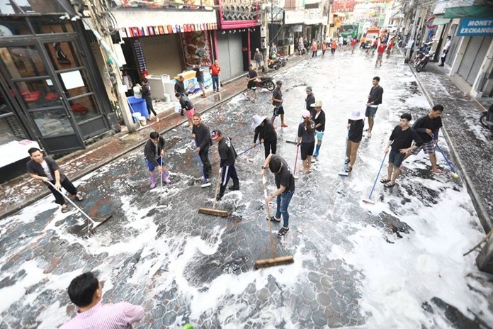 Deputy Mayor Manote Nongyai and nightlife strip businesses sweep, wash and scrub down Walking Street.