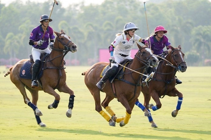 The polo match in action, between the La Familia Team (white) and Marengo Team (purple).