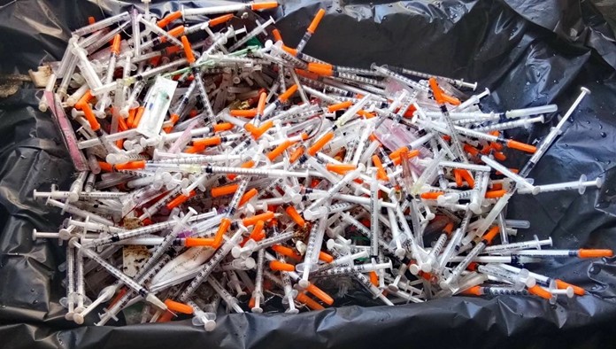 Hundreds of used syringes and blood-sample tubes were discovered on Samae San Beach, prompting fears of a public health threat.
