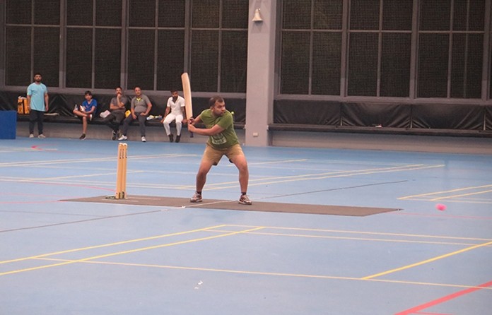 Rajish (AAS) defends his wicket.