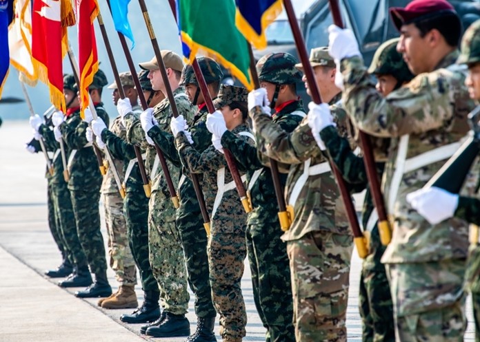 U.S. and Royal Thai Armed forces hold the flags of the participating nations of exercise Cobra Gold 2020 at the Camp Akathotsarot in Phitsanulok province, Tuesday Feb. 25, 2020. (U.S. Navy photo by Mass Communication Specialist 1st Class Julio Rivera)