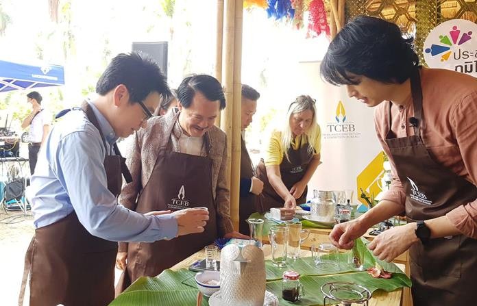 Pattaya City tourism advisor Rattanachai Sutidechanai and Banglamung Culture Council Chairman Surat Mekavarakul try Coco Coffee, a new community-run business that offers coffee flavored with locally grown coconuts.