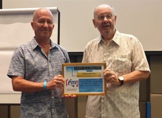 MC Brian Maxey presents the PCEC's Certificate of Appreciation to Graham Rawlings for his informative and interesting take on a good way to learn the Thai language.