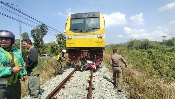 An unidentified car salesman rode around a lowered barrier at the rail crossing near Pattaya School No. 7 but didn’t make it. His motorbike was struck by cargo train 871 to Laem Chabang, killing the man.