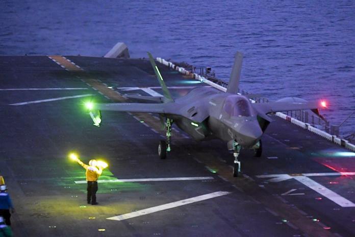 An F-35B Lightning II fighter aircraft assigned to the 31st Marine Expeditionary Unit (MEU), Marine Medium Tiltrotor Squadron (VMM) 265 (Reinforced) lands on the flight deck of amphibious assault ship USS America (LHA 6) in support of Exercise Cobra Gold 2020, Feb. 29, 2020. (U.S. Navy photo by Mass Communication Specialist 1st Class Rufus Hucks)