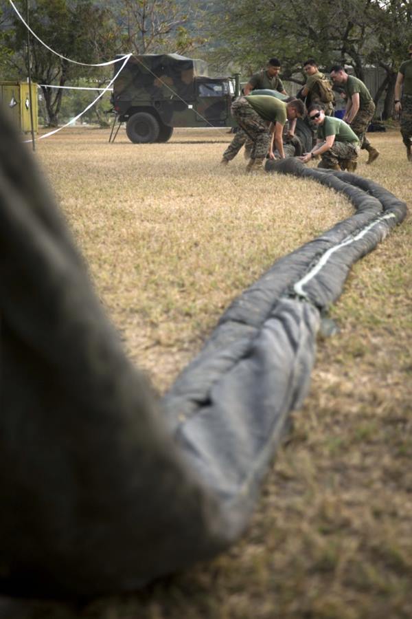 Photo By Staff Sgt. Jordan Gilbert | U.S. Marines with Marine Air Support Squadron 2, 1st Marine Aircraft Wing, unroll camouflage netting in order to conceal a direct air support center as part of Exercise Cobra Gold 2020 at Camp Phra Maha Jetsadaratchao, Chon Buri, Kingdom of Thailand, Feb. 26, 2020. (U.S. Marine Corps photo by Staff Sgt. Jordan E. Gilbert)