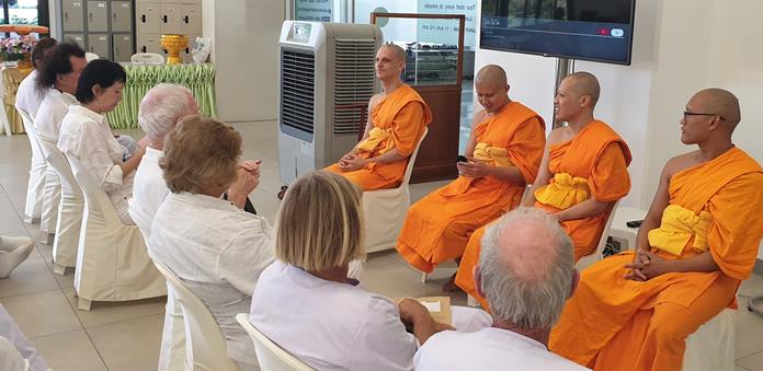 Monks from Wat Dhammakaya explain to their PCEC visitors the ceremonies being conducted for Makha Bucha Day and to answer any questions.