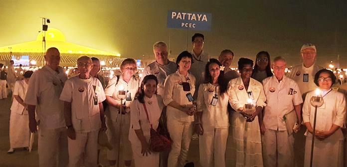 The PCEC group poses with their lit candles before participating in the Makha Bucha Day ceremonies.
