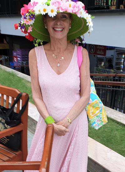 French Canadian Marie Nicole Roy has been going to Pink Polo for many years and won the Best Dressed hat once. She is prepared again as she arrives at the Markland for the van transportation.
