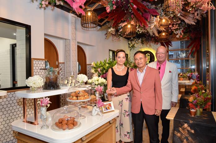 Yanin (left) with papa Dr. Sunya are all smiles as Gen. Paiboon Khumchaya points to delicacies on display in Nin & Co Patisserie.