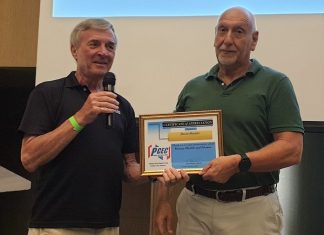 MC Ron Hunter provides David Shnider with the PCEC's Certificate of Appreciation for his very informative guidance on how older adults can keep fit through moderate exercise.