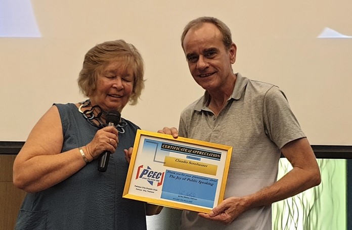 MC Pat Glynn presents Claudio Sennhauser with the PCEC's Certificate of Appreciation for his entertaining and informative talk about the joys of public speaking.