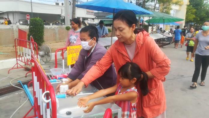 Wat Suttawas Flea Market set up hand wash areas for customers.
