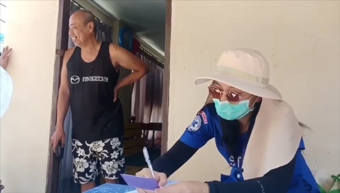 Medical volunteers check on families living on the island, screening them for coronavirus.