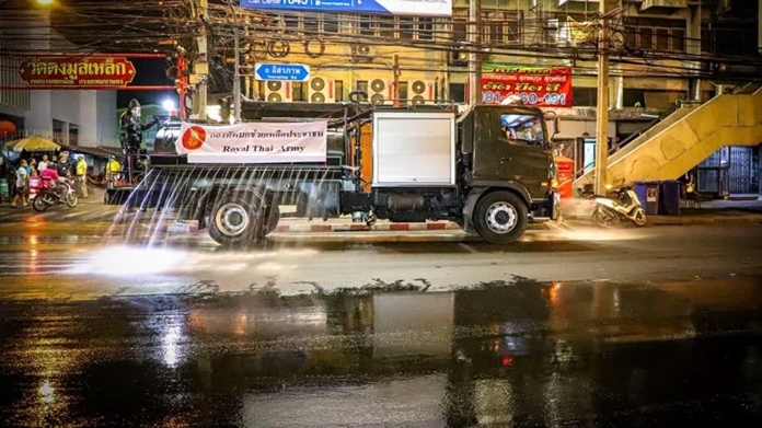 Pure alcohol from the Department of Naval Science was used to clean public areas around Wanglang Pier, Wang Lang Market and Siriraj Hospital in Bangkok Noi district.