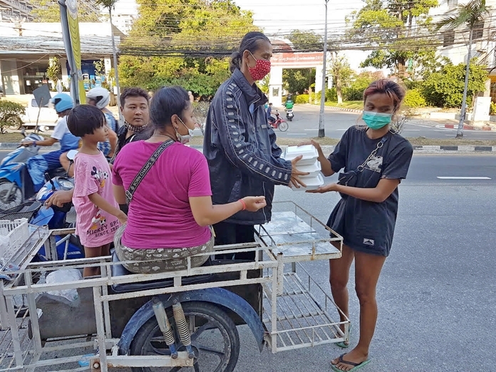 A man thankfully receives food for his family.