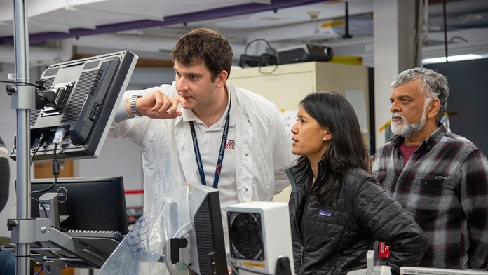 (Left to right) Mars Helicopter assembly, test, launch operations interface lead Teddy Tzanetos, project manager MiMi Aung and chief engineer Bob Balaram observe a flight test on Jan. 18, 2019, as the flight model of the Mars Helicopter was tested in the 25-foot-wide vacuum chamber at JPL. (Credits: NASA/JPL-Caltech)