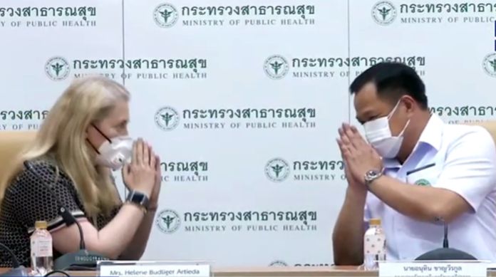 Swiss ambassador to Thailand Helene Budliger Artieda  and Minister of Public Health Anutin Charnvirakul greet each other with the traditional Thai ‘wai’ which is now the ‘New Normal’ gesture of greeting each other everywhere in the world.