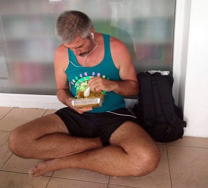 A tourist enjoys a delicious Nepalese meal.