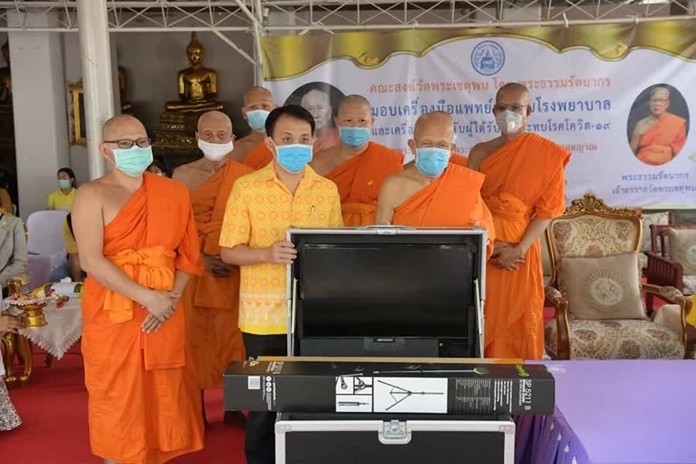 Wat Phra Chetuphon Vimolmangklararm donated medical equipment to hospitals and bags of supplies to people who are affected by the virus outbreak.