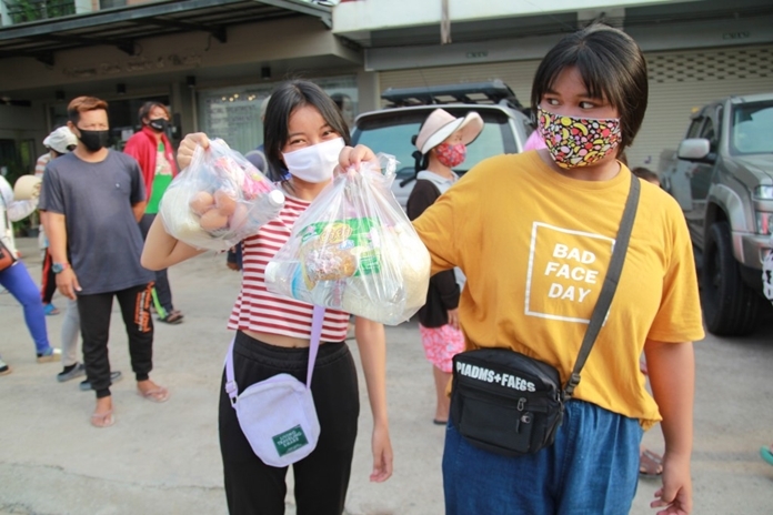 Despite the masks, happy faces show through.