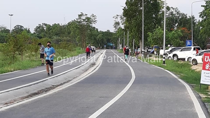 Joggers and cyclists on the exercise path around Mabprachan Lake are a sight for sore eyes.