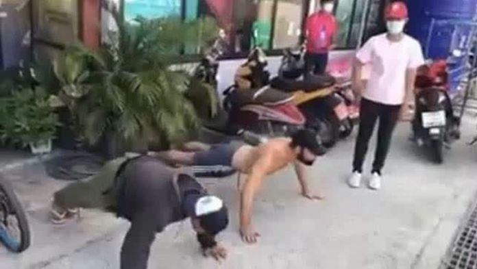 Tourists and Thai nationals found not wearing masks outside were punished with to do 20 push-ups and 20 jumping jacks at a checkpoint near Koh Tao pier.