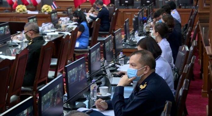 Thai Defense Ministry officials and their Chinese counterparts exchange their experiences in prevention and mitigation of COVID-19 via video conference.
