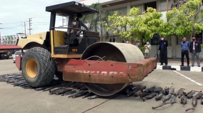 Illegally modified exhaust pipes have been confiscated from street racers in Samut Songkhram province and destroyed with road roller.