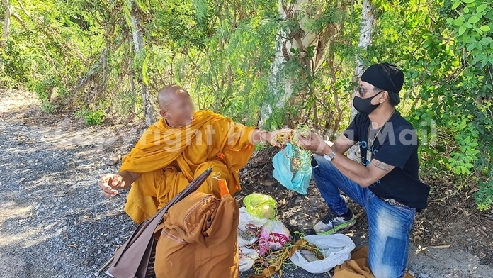 Najomtien police arrive to inspect his wares.