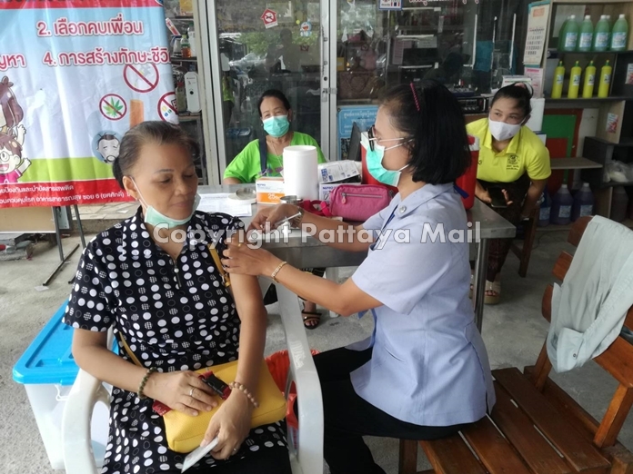 Pattaya public-health workers administer free flu shots at a community outreach visit to the Soi Khopai Community