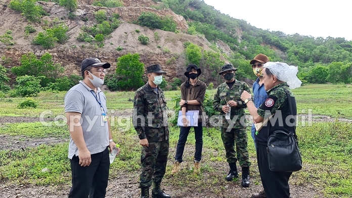 Capt. Chalermporn Klaythong, director of the Sattahip Naval Base’s Real Estate Division, led military personnel and local officials to the 80-rai property in the Plutaluang foothills for a survey.